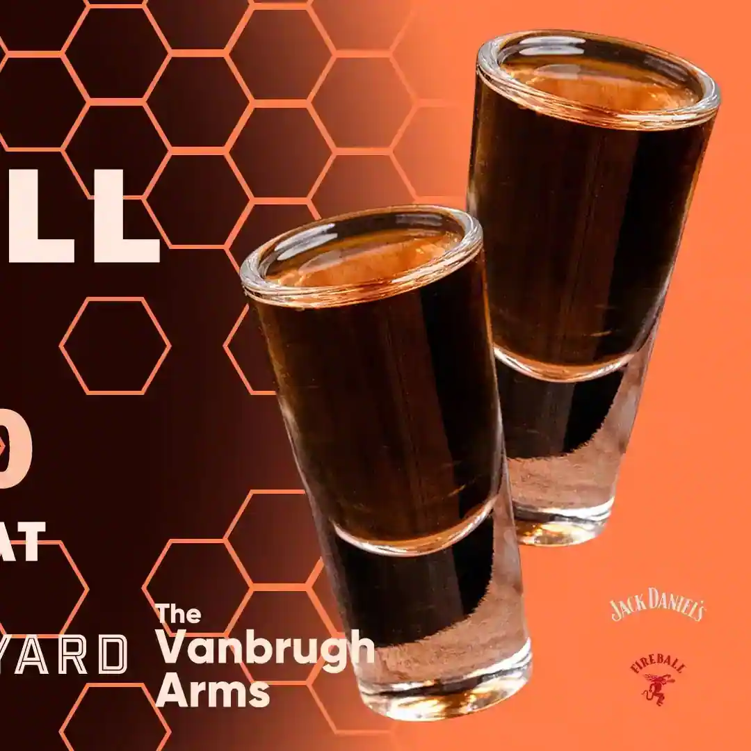 An advertisement for honey fireball shots with a dark background and honeycomb patterns